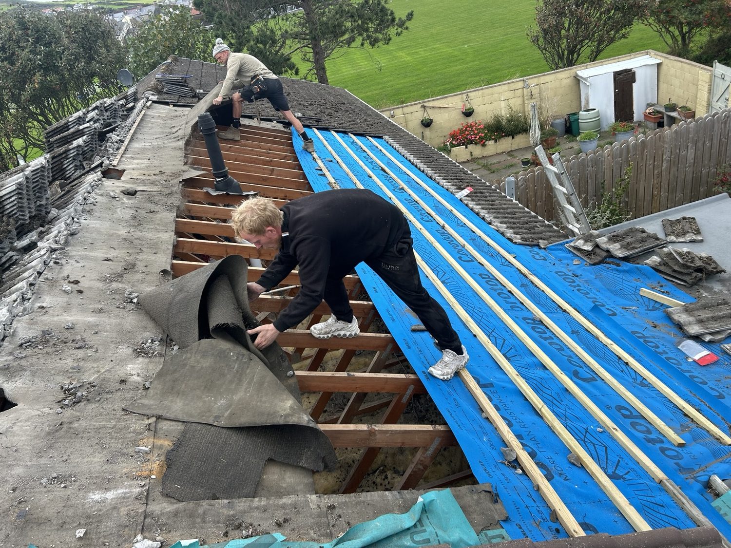 Roofing team working on a roof renewal